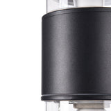 The Bronx Outdoor 2 Light Wall Light in black features a modern, sleek cylindrical design. Its dual-light structure enhances the minimalist allure, contrasting black and transparent elements that reveal metallic components inside.