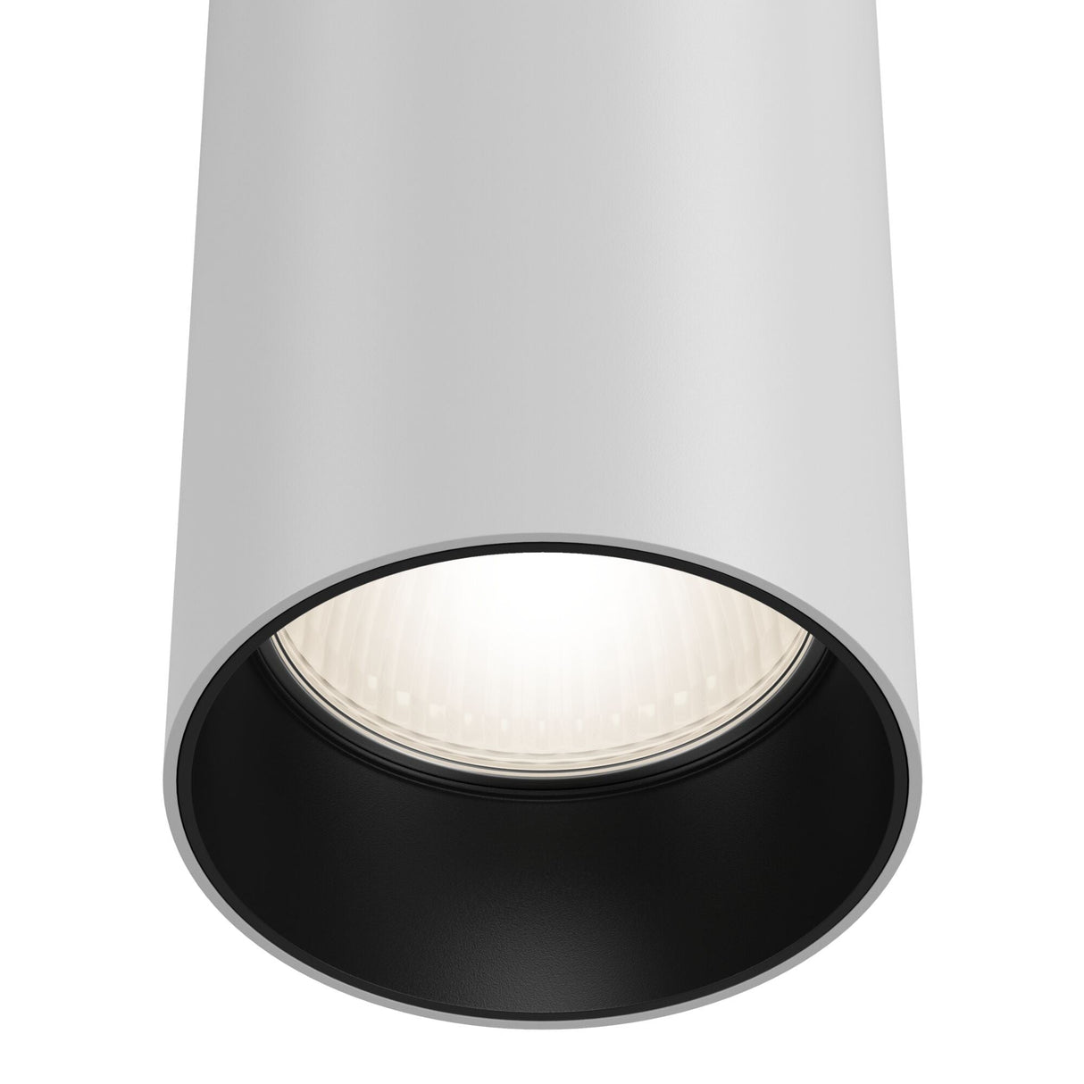 Close-up of the Focus Single phase UNITY Track Pendant Light in white. The pendant emits a bright glow with its adjustable cable. Its black interior contrasts with the outer surface, enhancing its modern industrial look, viewed from below.