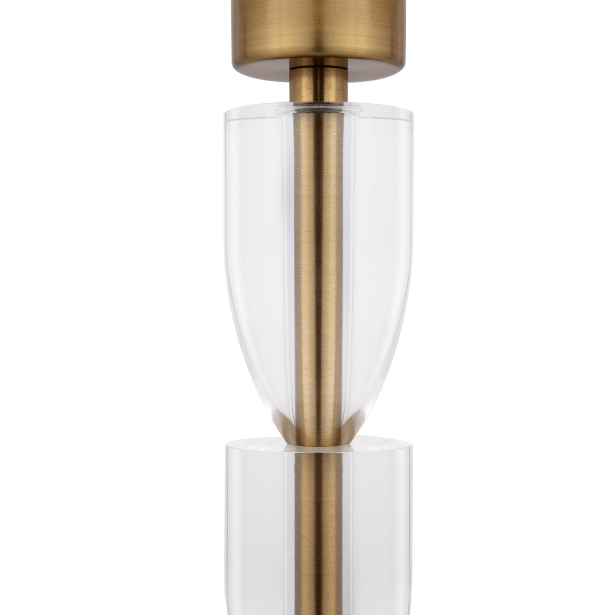 Close-up of the Prima Table Lamp - Brass With White Shade, highlighting its modern Bauhaus design with a brass frame and sleek, overlapping cylindrical elements for a sophisticated layered effect.