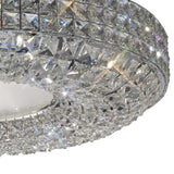 Close-up of the Diyas Enya 9 Light flush ceiling light showing layered Asfour cut crystal bands on a polished chrome frame with frosted white diffuser.