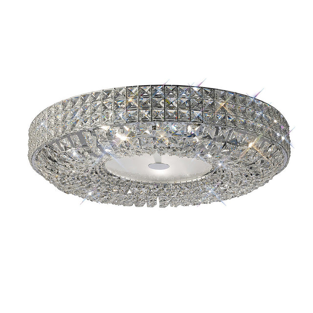 Diyas Enya 9 light flush ceiling light with stacked crystal bands and frosted diffuser on a polished chrome circular frame, shown on white.