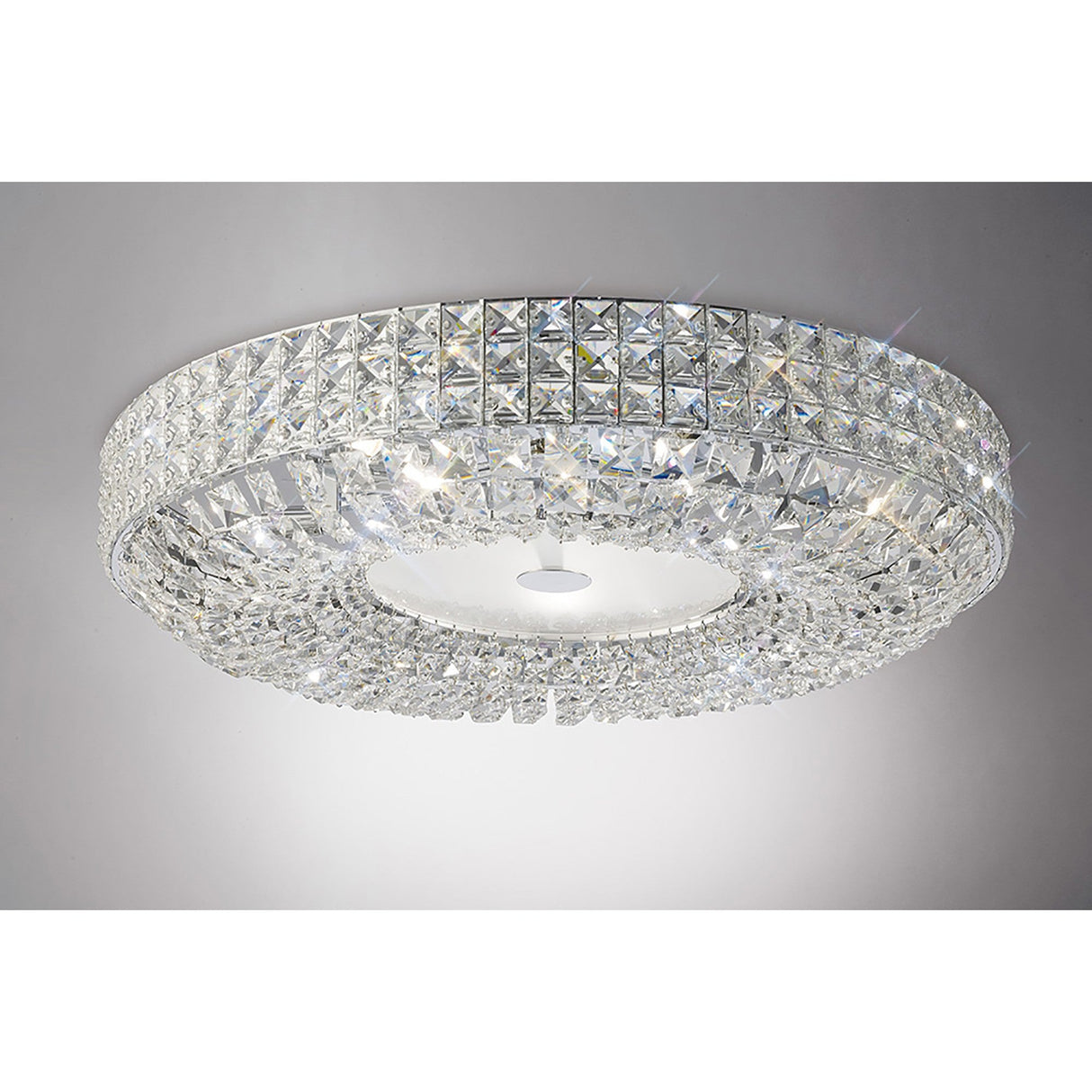 Diyas Enya 9 light crystal flush ceiling light with stacked square-cut crystal bands on a polished chrome frame and frosted white centre diffuser.