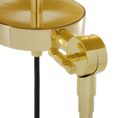 Close-up of the Erill Brass Tripod Floor Lamp's adjustable joint, showing a polished brass swivel bracket connecting the stem and leg against a white background.