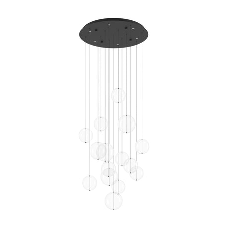 Espardello multi-light pendant with a round black steel canopy and clear glass globe shades hanging at staggered heights on fine wires, shown on a plain white background.