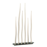 The Estalacta 6 Light Floor Lamp in Silver & Opal White features six tall, slender curved rods of varying heights on an oval black base, resembling abstract reeds for a modern, sculptural lighting statement.