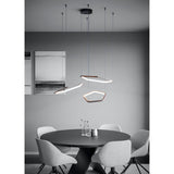 Estrella Pendant Light with three bronze hexagonal LED rings at varied heights from a black ceiling canopy, shown above a round dining table in a grey room.