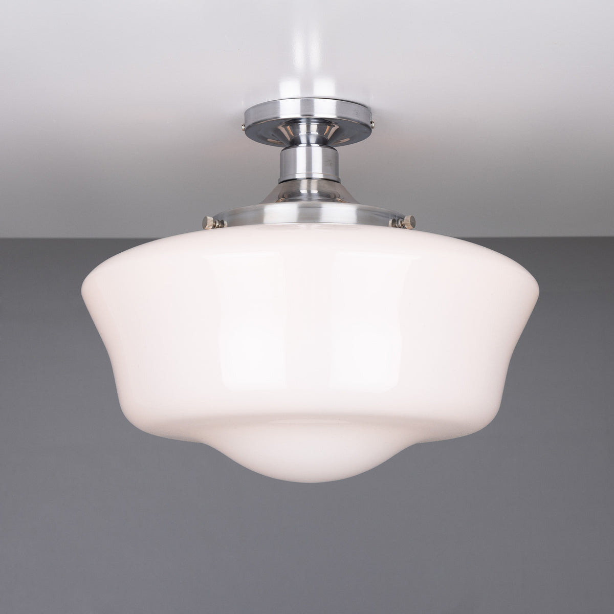 Ethrina Glass Semi Flush Ceiling Light with white opal schoolhouse-style glass shade and polished chrome fitting, mounted close to a plain grey ceiling.