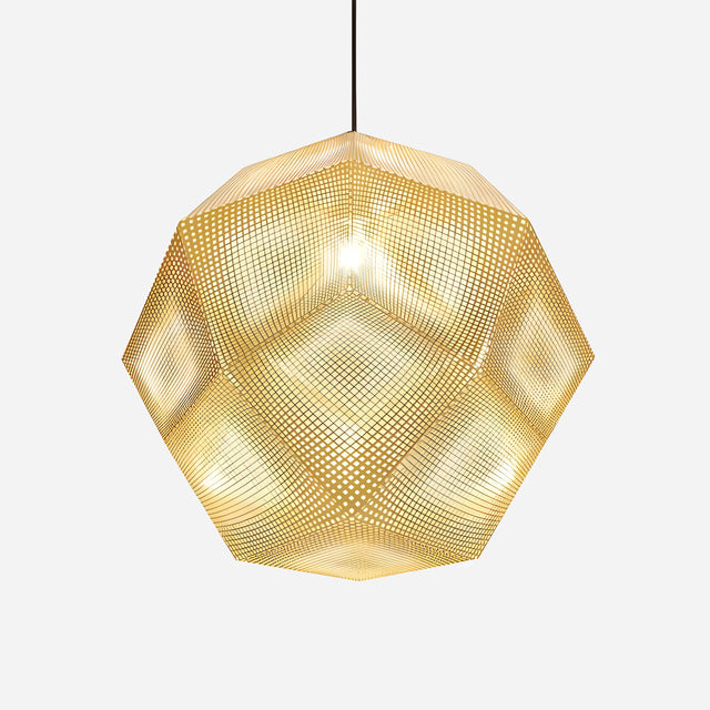 The Rango Large Pendant Light - Gold showcases a geometric design crafted from perforated metal that casts a warm glow. This elegant fixture creates intricate patterns of light and shadow and hangs by a slender black cord, contrasting beautifully against a simple white backdrop.