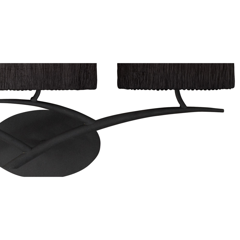 Close-up of Eve wall light showing curved anthracite steel arms and pleated black fabric shades against a white background.
