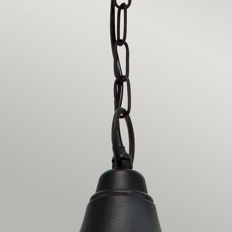 A close-up of the Firenze Outdoor 1 Light Chain Pendant in black, reminiscent of an IP54 Rated Lantern, hanging from a chain against a plain gray background. The focus is on the sturdy chain links and the top part of the light fixture.