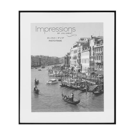 Matt black rectangular photo frame with a white mount, holding a sample print of a canal scene, shown upright on a plain white background.