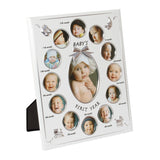 Silver metal multi-aperture photo frame with twelve round monthly openings labelled 1st to 12th month around a central oval photo, "Baby's First Year" text, on a white background.