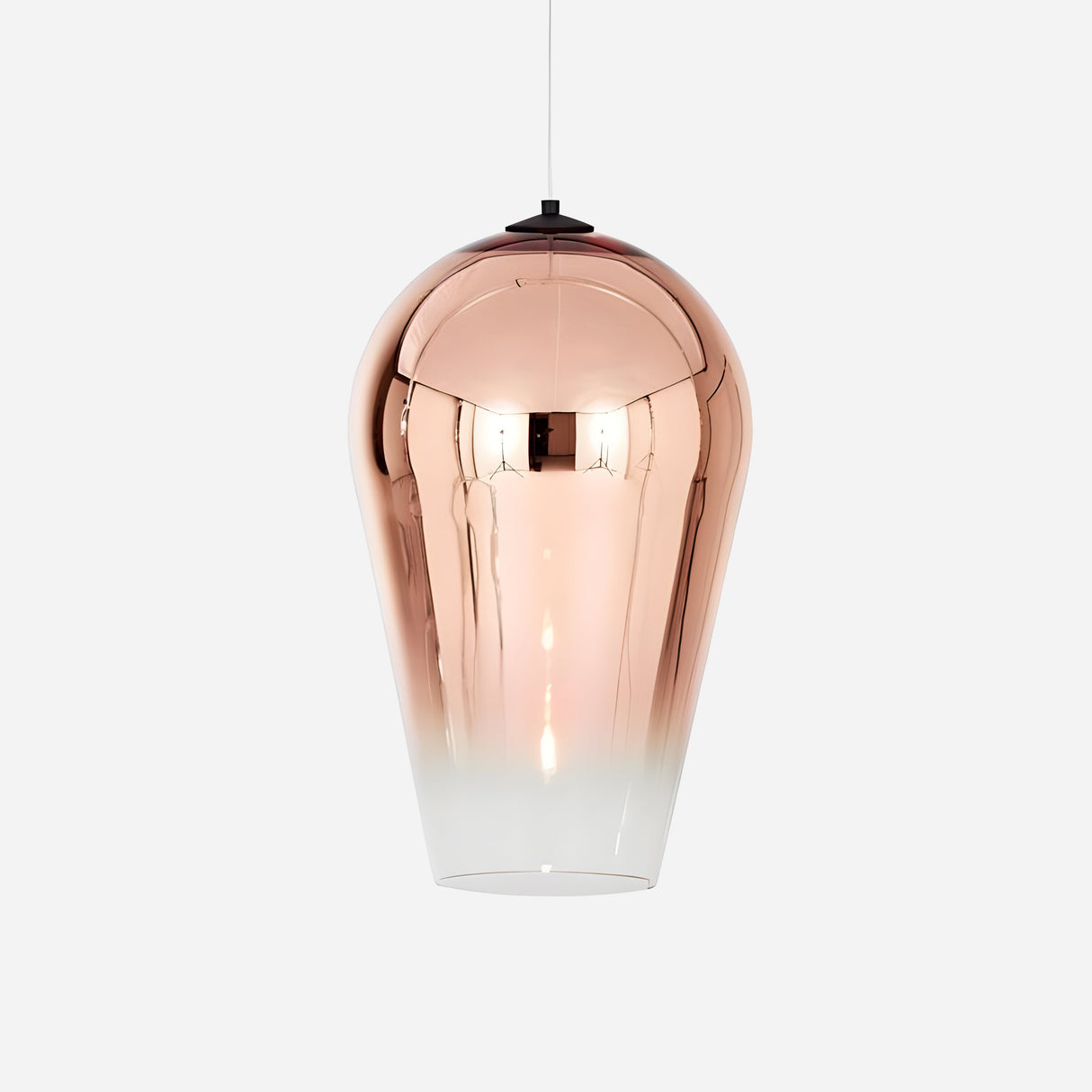 The Slice Glass Pendant Light - Copper features a handcrafted design with a sleek metallic copper finish that gracefully transitions into a frosted white base. Suspended by a thin cord against a plain white background, this exquisite piece effortlessly adds sophistication to any space.
