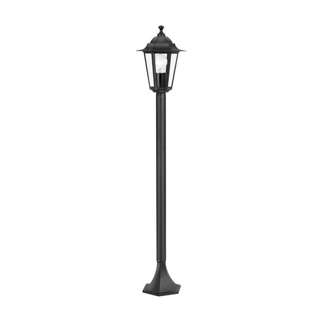 Fasvette Bollard Light in black, a traditional garden post light with a six-sided clear glass lantern head, slim round pole, and flared hexagonal base, shown on a plain white background.