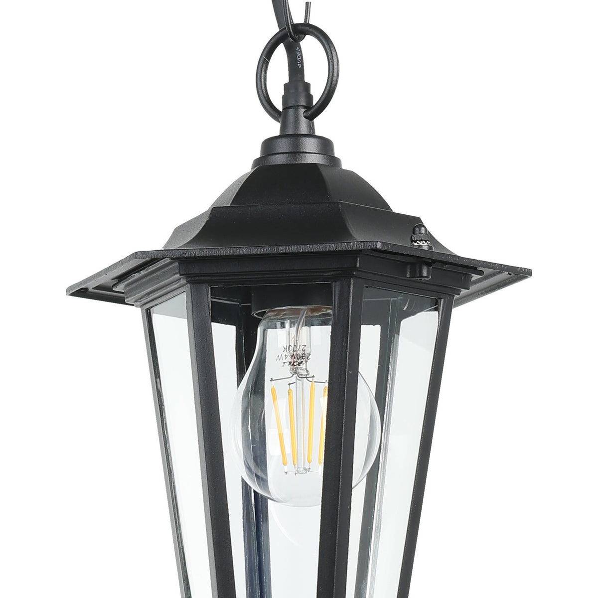 Fasvette lantern-style pendant light in black cast aluminium with clear glass panels, shown with an exposed filament bulb, suspended from a black chain against a white background.