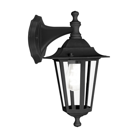 Fasvette outdoor wall light in black, a six-sided lantern with clear glass panels and visible bulb, mounted on a curved wall arm with top and base finials, shown on a plain white background.