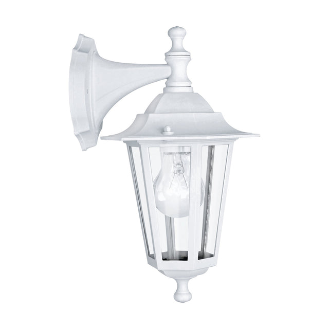 Fasvette Downward Outdoor Wall Light in white cast aluminium with a six-sided clear glass lantern, curved wall arm, turned finials, and visible E27 bulb, shown on a plain white background.