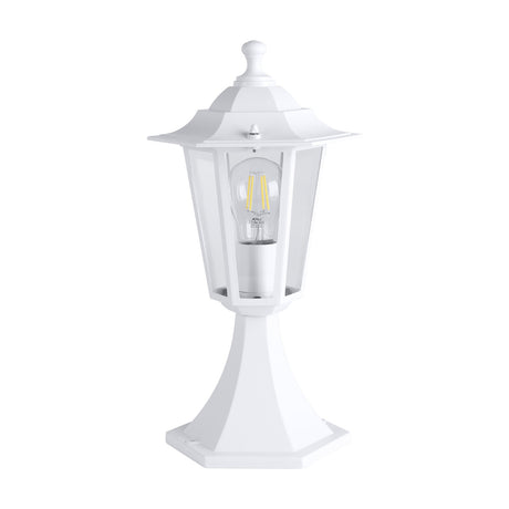 Fasvette outdoor post light in white, a hexagonal lantern with clear glass panels, finial top, and tapered aluminium pedestal base, shown with E27 bulb on a plain white background.