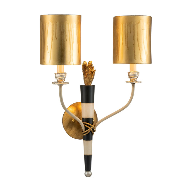 The Flambeau 2 Light Wall Light With Parchment Shade - Gold & Black showcases a Mardi Gras-inspired design, featuring two curved arms supporting cylindrical gold lampshades. Its central base is adorned with gold and black accents, emphasized by an ornamental centerpiece. The circular wall mount is gracefully finished in gold, enhancing its festive appeal.