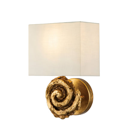 The Swirl 1 Light Large Wall Light - Gold Leaf is a decorative wall sconce that showcases a white rectangular lampshade paired with an ornate, gold leaf base shaped like a swirl. The light casts a soft glow, accentuating the artistic design of the fixture.