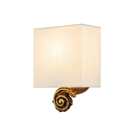 The Swirl 1 Light Small Wall Light - Gold Leaf showcases a modern elegance with its white rectangular shade and decorative golden spiral accent at the base, highlighted by a subtle gold leaf finish.