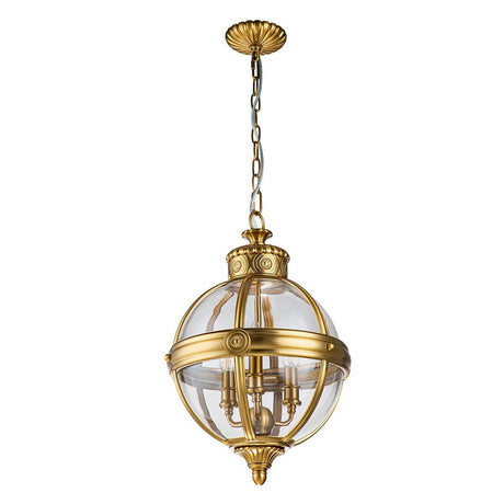 The Adams 3 Light Chandelier in Burnished Brass exudes vintage charm with its Victorian design elements, showcasing a golden metal frame and a spherical glass shade. Suspended from a decorative chain, this luxurious light fixture boasts intricate detailing and multiple candle-shaped bulbs within.