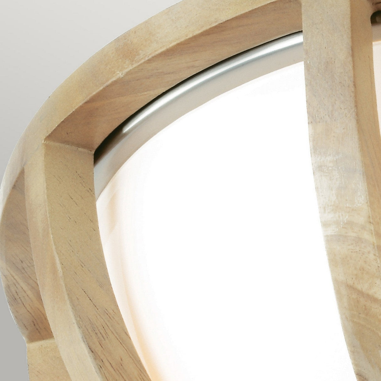 Close-up of the Allier 2 Light Flush fixture in light wood and brushed steel, showcasing a frosted glass dome encased by a light wood frame. The overlapping wooden strips form a geometric pattern, set against a neutral gray background.