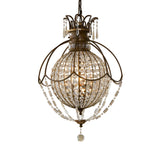The Bellini 3 Light Chandelier in Oxidized Bronze/British Bronze features a spacious spherical design with an intricate metal frame, embellished with antique quartz crystals and beads. It emits a warm glow reminiscent of the 1920's French Chateau style, enhancing its decorative elements.
