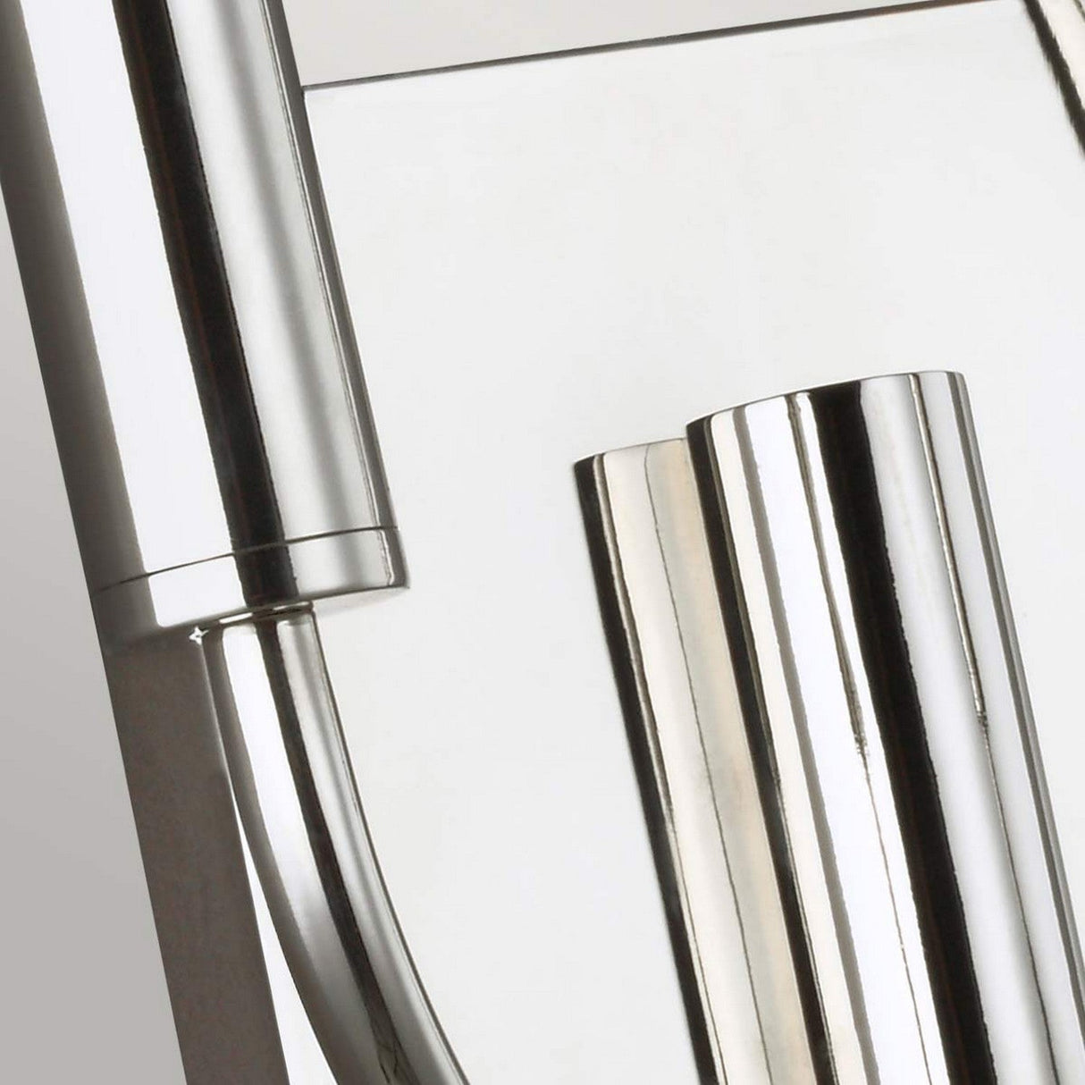 Close-up view of the Brianna 2 Light Wall Light - Polished Nickel, showcasing sleek, polished metal rods and a minimalist design. The composition highlights the light's shiny, reflective surfaces against a neutral background, reminiscent of polished nickel accents enhancing ambient illumination in contemporary spaces.