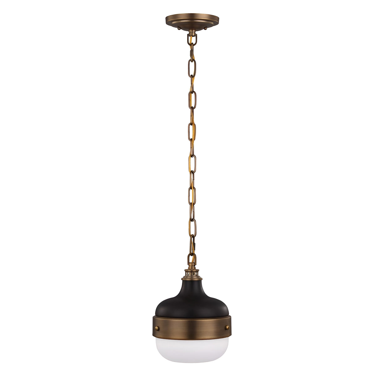 Introducing the Cadence 1 Light Mini Pendant in Dark Antique Brass and Matte Black. This elegant fixture boasts a round, modern design with a white glass shade at its base. It hangs from a brass chain attached to the ceiling mount, offering a vintage-industrial charm to any room.