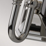 A close-up of the Concord 1 Light Wall Light - Polished Chrome reveals its curved design, accentuating the reflective surface and smooth contours. The opal-etched glass shade enhances its modern and sleek aesthetic.