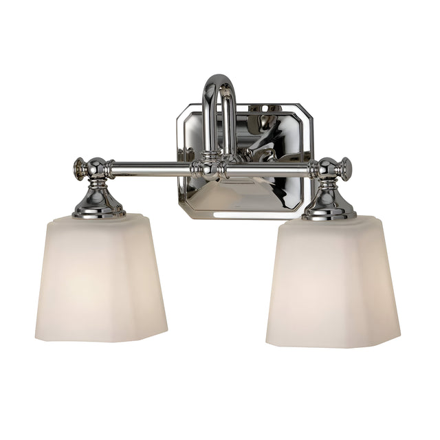 The Concord 2 Light Wall Light - Polished Chrome showcases a polished chrome fixture complemented by opal-etched glass shades. It features a geometric backplate and elegantly curved arm design, making it a sleek contemporary piece ideal for modern interiors.