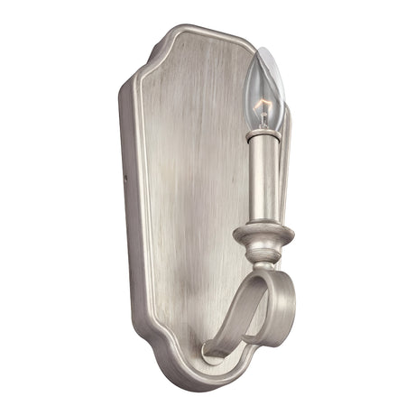 The DeWitt 1 Light Wall Light in Sunrise Silver boasts a vintage French Provincial style, featuring a curved arm that holds a single exposed bulb. This wall sconce's intricate backplate and candle-like design enhance its classic elegance.