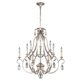 Introducing the DeWitt 9 Light Chandelier - Silver: This elegant piece showcases eight upward-curving arms, each adorned with a candle-shaped bulb. The chandelier's French Provincial design is complemented by hanging teardrop crystals, adding a sophisticated and classic touch.