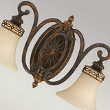 Introducing the Drawing-2 Room 2 Light Wall Light - Walnut: a beautifully ornate wall sconce in an Edwardian-style. This fixture boasts two fluted glass shades and elegant decorative metalwork with an antique bronze finish, featuring intricate scroll designs and embossed detailing on its central medallion.