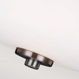 Close-up of the Evington 2 Light Semi Flush in satin nickel, showcasing a contemporary ceiling light with a circular mount connected to a large, white dome-shaped shade. The minimalistic design adds a sleek and modern touch.