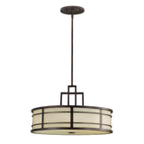 The Fusion 3 Light Chandelier - Grecian Bronze is a round, modern pendant light that hangs from the ceiling. It showcases a dark Grecian Bronze metal frame paired with a frosted, cream-colored glass shade and incorporates geometric design elements reminiscent of the Arts & Crafts movement.
