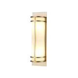 The Fusion 2 Wall Light in Painted Natural Brass is a modern wall sconce featuring a sleek and minimalist rectangular metal frame with an opal glass shade, providing a soft, warm light ideal for contemporary interior spaces.