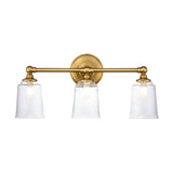 The Huguenot Lake 3 Light Wall Light in burnished brass exudes a Colonial design. This sophisticated fixture features three lights with opaque seeded glass shades. Its central circular base and two horizontal bars lend a timeless appeal, while the slightly tapered shades reveal a speckled detail.