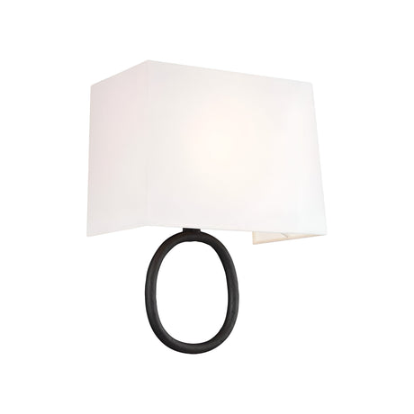 Introducing the Indo 1 Light Wall Light, featuring an off-white cotton rectangular shade and an aged iron finish on its black circular base. This stylish design marries geometric shapes with a hint of rustic charm, perfectly enhancing its contemporary minimalist aesthetic.