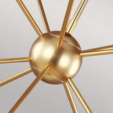 Close-up of the Jax 10 Light Chandelier - Burnished Brass, showcasing a central gold sphere with multiple rods extending outward in a starburst design that embodies the essence of Art Deco against a plain background.