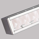 Close-up of the Jessie 1 Light LED Wall Light in polished chrome, showcasing its modern rectangular design with a metallic frame and an intricate pattern of faceted crystals inside, set against a plain gray background.
