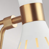 Close-up of the Joan 1 Light Wall Light, featuring a modern aesthetic with a matte white finish and burnished brass accents. The fixture flaunts a sleek, minimalist design highlighted by circular gold stripes near its base.