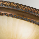 The Kelham Hall 2 Light Flush - Firenze Gold/British Bronze features a decorative fixture with British Bronze metal trim, showcasing intricate geometric patterns atop a frosted, cream-colored glass dome. The design exudes a vintage, ornate appearance reminiscent of Kelham Hall's timeless elegance.