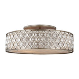 Introducing the Lucia 6 Light Flush - Burnished Silver: This round, ceiling-mounted light fixture showcases a metallic frame with an interlocking teardrop pattern and a burnished silver finish. The outer layer features translucent panels that gently diffuse light, making it an ideal choice for elegant luxury lighting solutions.