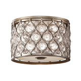 The Lucia 2 Light Flush - Burnished Silver is a circular ceiling light fixture with a decorative metal lattice design adorned with embedded Bauhinia crystals, finished in burnished silver for a vintage allure.