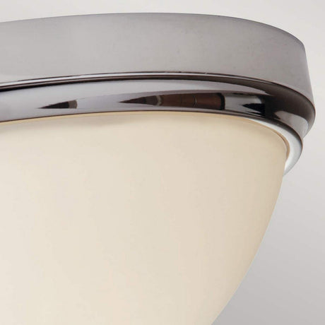 Here's a close-up of the Malibu 2 Light Flush with a polished chrome rim and frosted glass shade. Its sleek design conveys a modern aesthetic, softly illuminating the surrounding area.