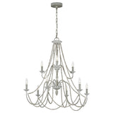 The Maryville 9 Light Chandelier - Washed Grey embodies French Country elegance with its two-tiered, nine candle-style lights. Its design includes graceful cascading chains and an intricately detailed metal frame, adding a touch of rustic charm to any room while being stylishly suspended by a chain from a circular ceiling mount.