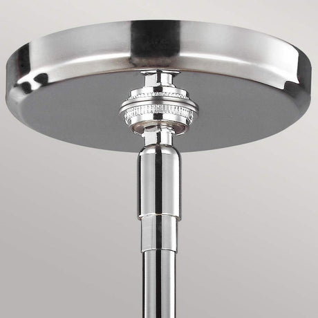 Close-up of the Paulson 3 Light Pendant in chrome showcasing its sleek design, modern finish, adjustable stem, and vintage glass detailing, set against a light gray background.