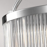 Close-up of the Paulson 6 Light Pendant - Chrome, featuring vertical glass tube shades. The light filters through the clear glass, offering a modern and sophisticated look against a neutral background.